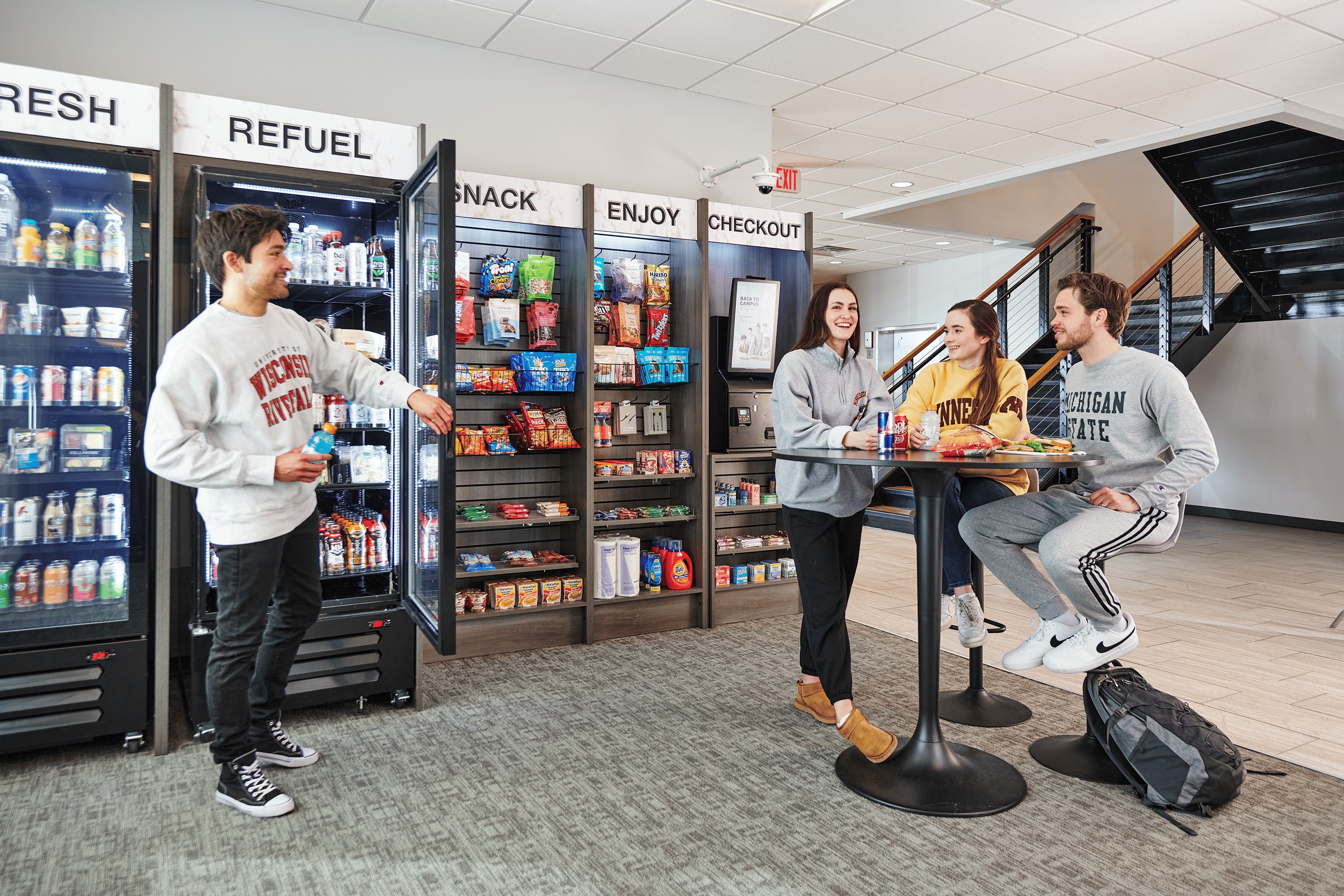 modern self-checkout micro market kiosk in a bright corporate breakroom