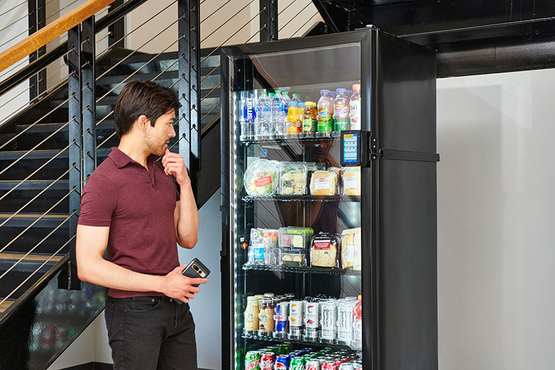 Smart connected cooler with healthy drinks and fresh food in a modern office